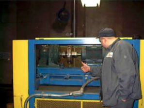 Employee looking at installation of magnetic couplings